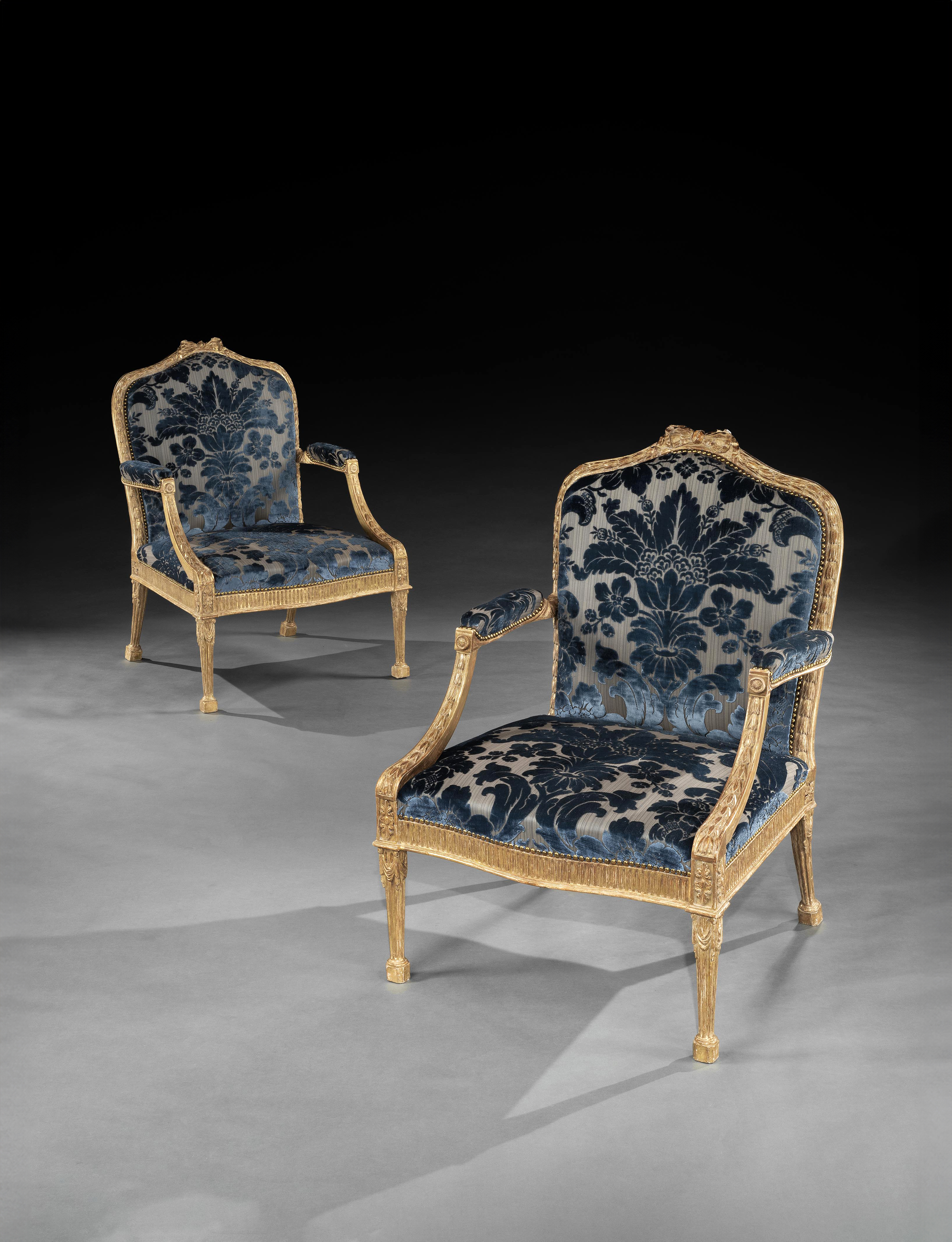 A Pair of George III Period Carved and Gilded Armchairs attributed to John Linnell